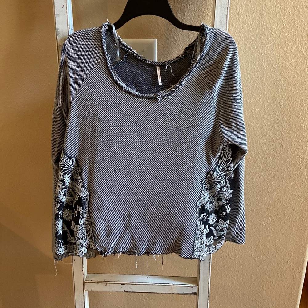Black and white distressed light sweater